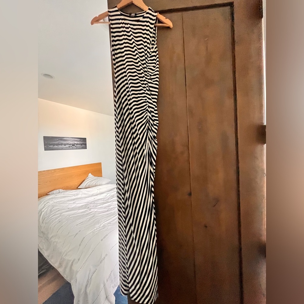 Striped slinky maxi dress with side ruching and side slit.